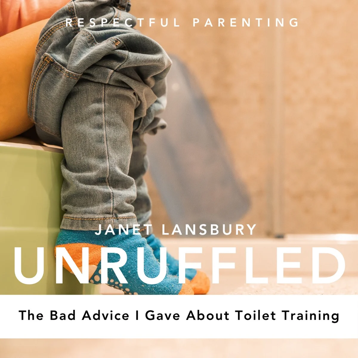 Toddler sitting on small potty chair in bathroom
